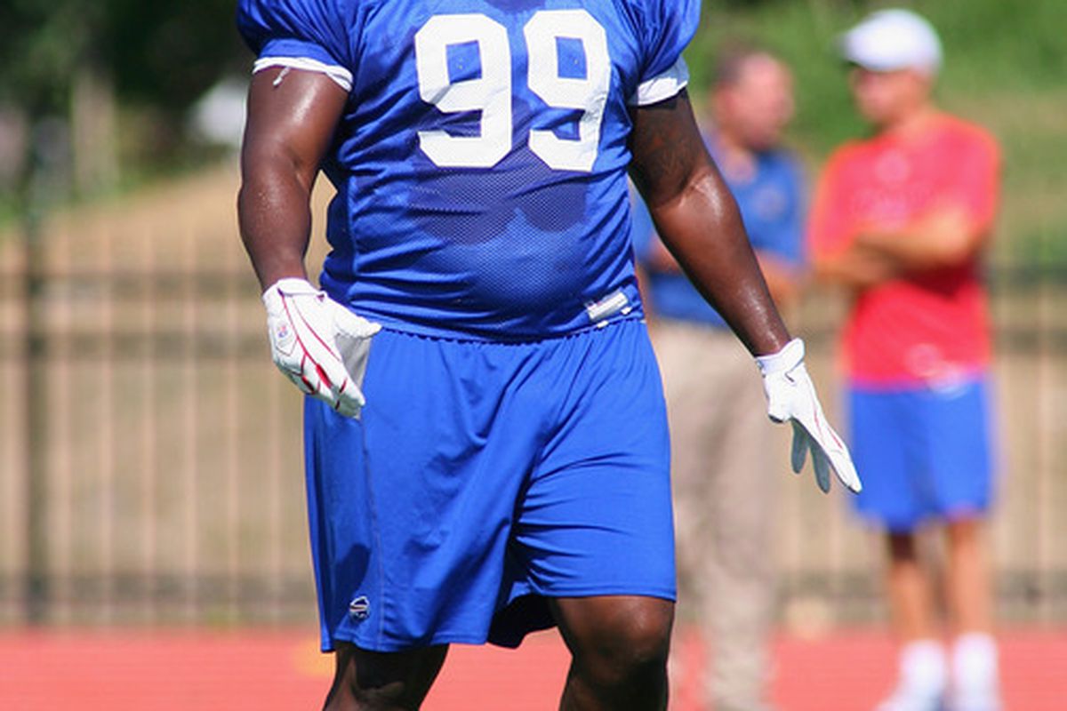 PITTSFORD, NY - AUGUST 08:  Marcell Dareus #99 of the Buffalo Bills readies for a play during the Buffalo Bills Training Camp at St. John Fisher College on August 8, 2011 in Pittsford, New York.  (Photo by Rick Stewart/Getty Images)