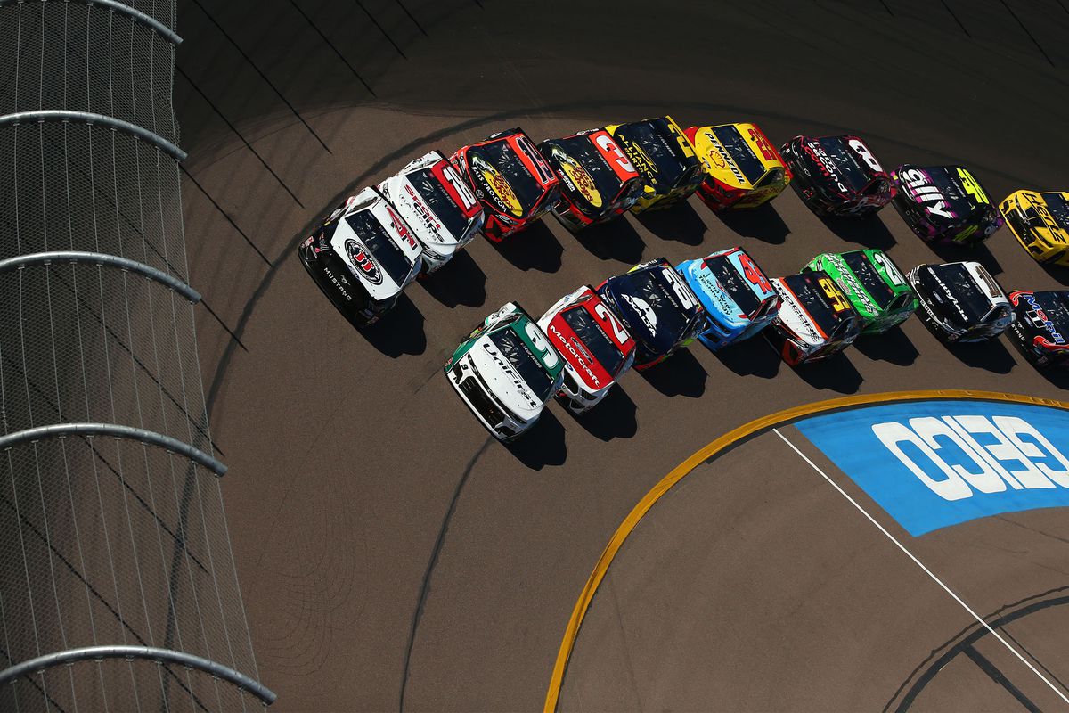 NASCAR Cup Series driver Chase Elliott and Kevin Harvick lead the pack during a restart at the FanShield 500 at Phoenix Raceway