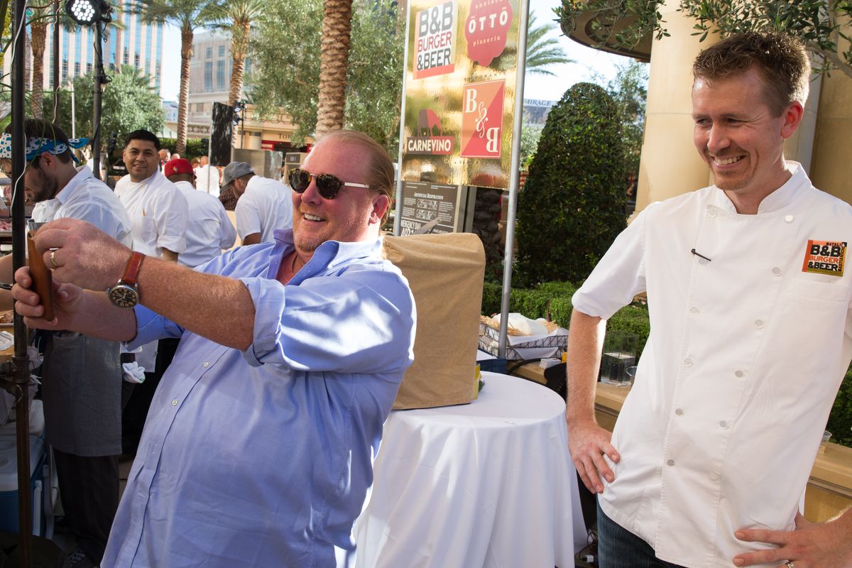 Chef Mario Batali takes a selfie with chef Jason Neve from the B&B empire at the Carnival of Cuisine.