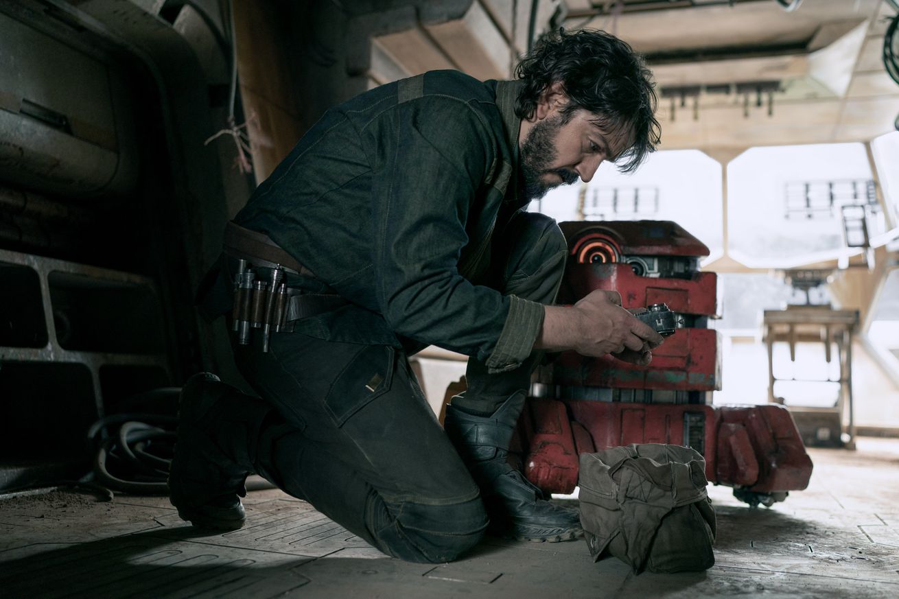 A photo of Diego Luna and the droid B2EMO in the Star Wars series Andor.