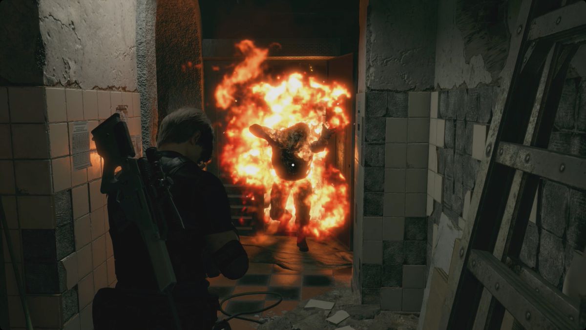 Resident Evil 4&nbsp;remake&nbsp;Leon getting attacked by a flaming zealot