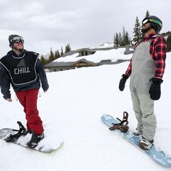 Ricky Ballesteros, right, snowboards with Spencer Packer and other youth from the Chill Foundation at Brighton on Monday, March 20, 2017.