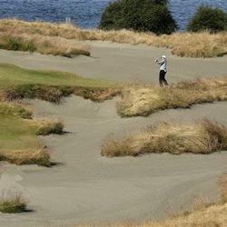 Rory McIlroy, of Northern Ireland, hits out of the bunker on the 15th hole during a practice round for the U.S. Open golf tournament at Chambers Bay on Wednesday, June 17, 2015 in University Place, Wash. (AP Photo/Charlie Riedel)