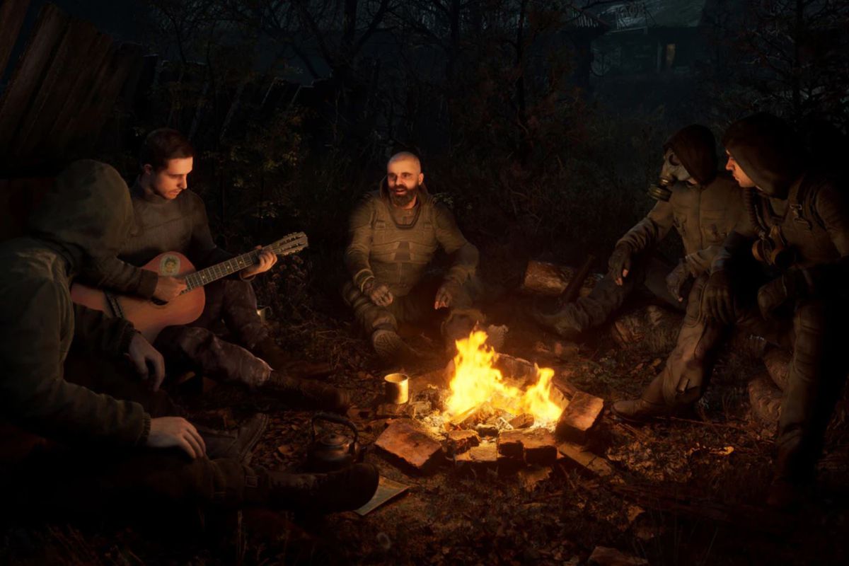 A group of STALKERs gather around a campfire with a guitar to sing through the night near Chornobyl.