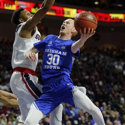 Brigham Young Cougars guard TJ Haws shoots with Gonzaga Bulldogs forward Johnathan Williams defending during the West Coast Conference championship game in Las Vegas on Tuesday, March 6, 2018.