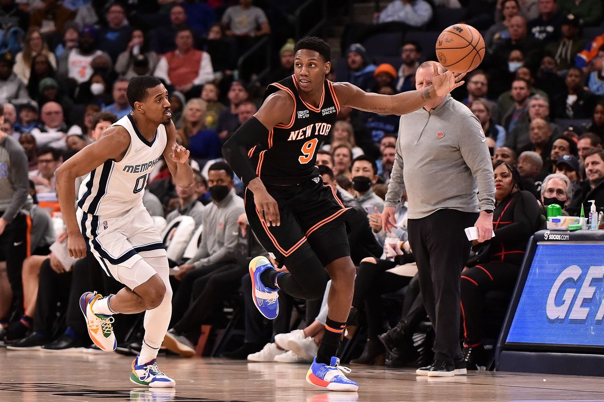 RJ Barrett #9 of the New York Knicks brings the ball up court against De’Anthony Melton #0 of the Memphis Grizzlies during the second half at FedExForum on March 11, 2022 in Memphis, Tennessee.