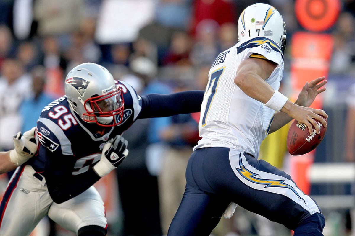 FOXBORO, MA -  SEPTEMBER 18:  Mark Anderson #95 of the New England Patriots chases  Philip Rivers #17 of the San Diego Chargers in the first half at Gillette Stadium on September 18, 2011 in Foxboro, Massachusetts. (Photo by Jim Rogash/Getty Images)