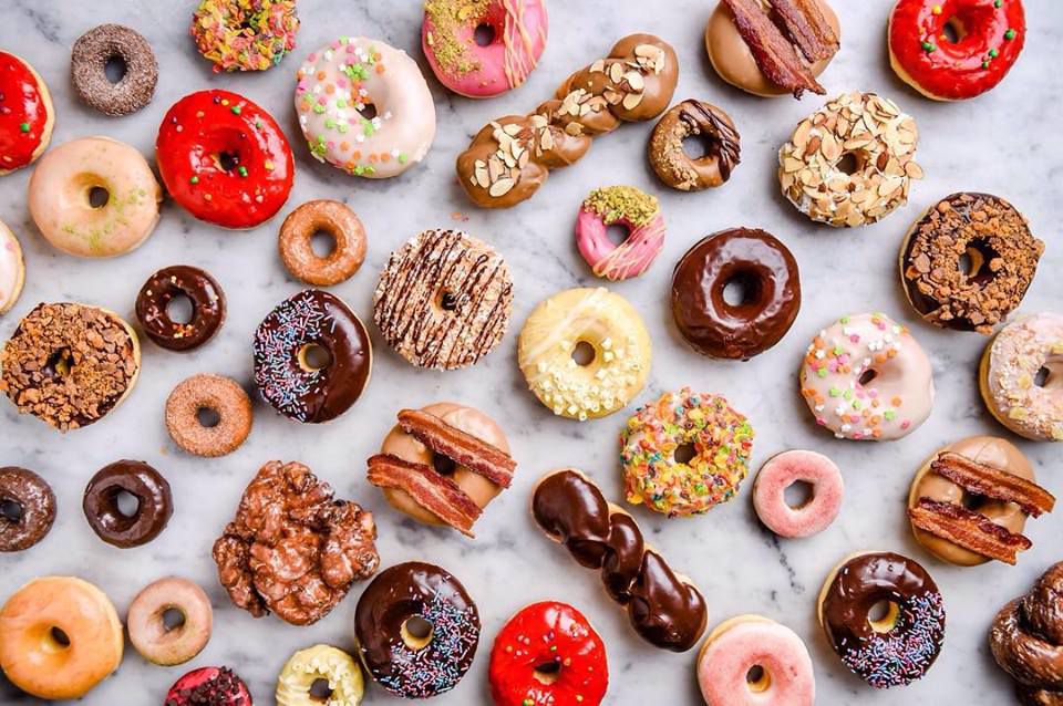 A wide selection of every kind and shape of doughnut
