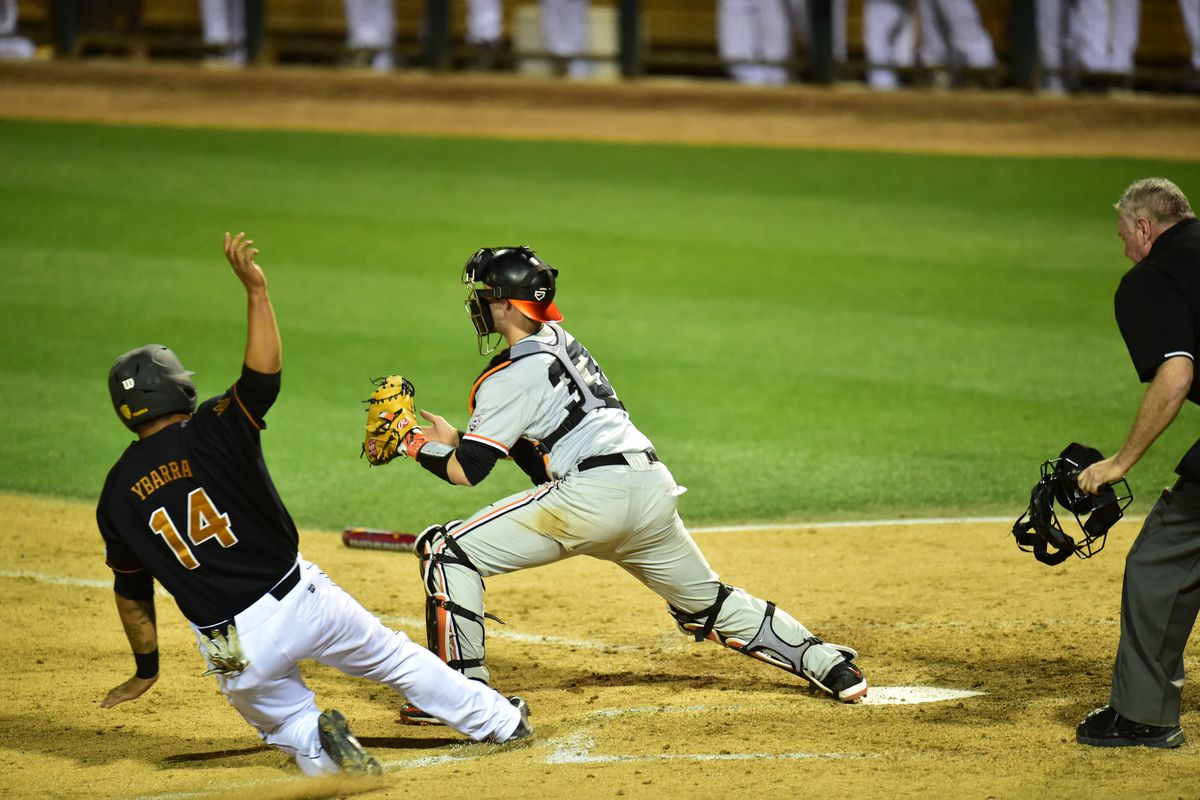 RJ Ybarra, 14, is thrown at home on a failed squeeze attempt in the seventh inning against Oregon State. ASU lost 1-0