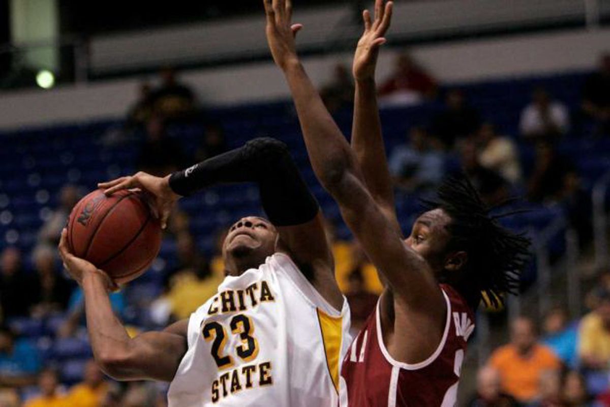 Wichita State's Toure Murry, left, goes up for a shot against Alabama’s Levi Randolph during a NCAA basketball game in San Juan, Puerto Rico, Friday, Nov. 18, 2011. (Ricardo Arduengo / AP)
