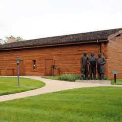 In late 1847 in Kanesville, Iowa, 200 pioneers built a 40 by 60 foot log tabernacle in two and a half weeks. This replica was erected near the original site in downtown Council Bluffs with donated funds. President Gordon B. Hinckley dedicated it July 13, 1996.