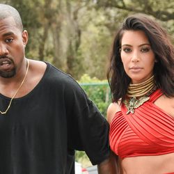 Kanye West, left, and Kim Kardashian arrive at the Roc Nation Pre-Grammy Brunch at RocNation Offices on Saturday, Feb. 7, 2015, in Beverly Hills, Calif. 