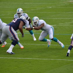 Dec. 15, 2013 Miami Gardens, FL - Miami Dolphins defensive end Cameron Wake (91) fires off the line of scrimmage in the first half of the team's game against the New England Patriots.