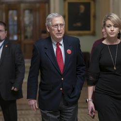 Senate Majority Leader Mitch McConnell, R-Ky., leaves the chamber as the Senate waits to take up a House-passed bill that would pay for President Donald Trump's border wall and avert a partial government shutdown at midnight, at the Capitol in Washington, Friday, Dec. 21, 2018.