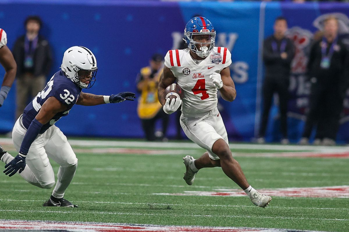 Mississippi Rebels running back Quinshon Judkins (4) runs the ball against the Penn State Nittany Lions in the second quarter at Mercedes-Benz Stadium.
