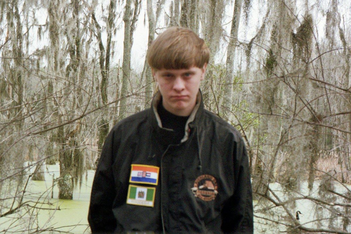 Dylann Storm Roof, with the apartheid South African (top) and Rhodesian flags.