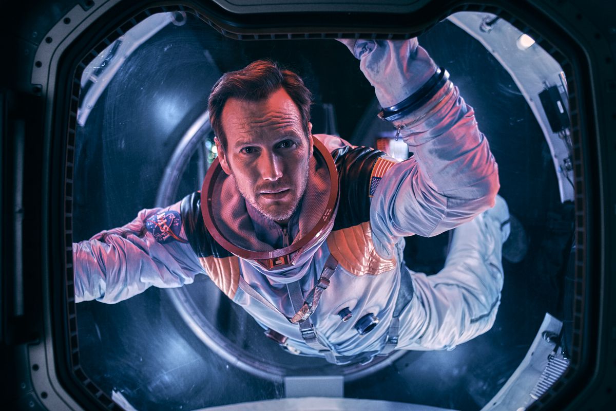 Patrick Wilson in a spacesuit floats in an airlock in Moonfall