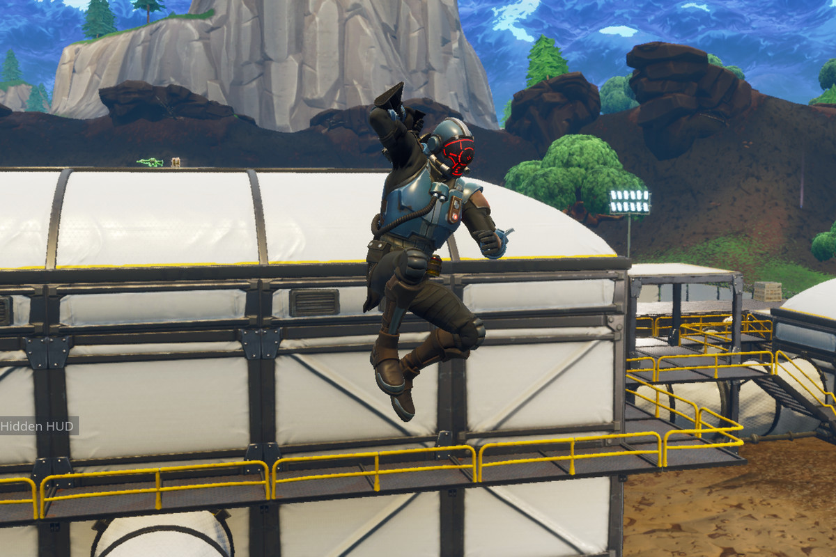 Fortnite - guy jumping down from atop a structure