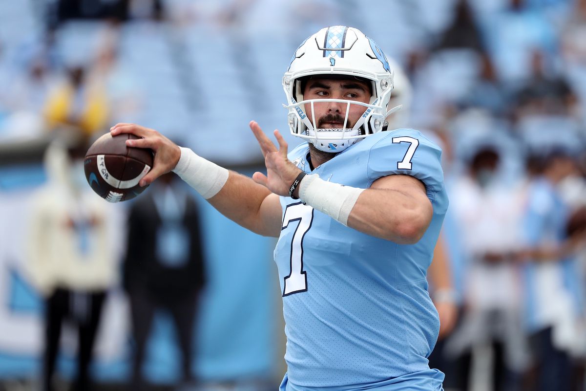 Sam Howell of the North Carolina Tar Heels warms up during their game against the Florida State Seminoles at Kenan Memorial Stadium on October 09, 2021 in Chapel Hill, North Carolina.