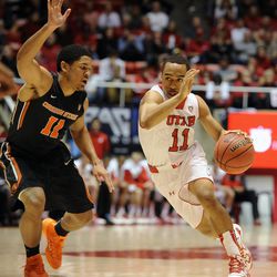 Utah Utes guard Brandon Taylor (11) drives to the basket as Oregon State Beavers guard Malcolm Duvivier (11) defends during a game at the Jon M. Huntsman Center on Saturday, Jan. 4, 2014.