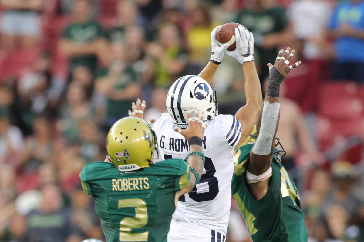 BYU wide receiver Gunner Romney grabs a reception in double coverage in a game against USF at Raymond James Stadium in Tampa, Florida on Saturday, Oct. 12, 2019.