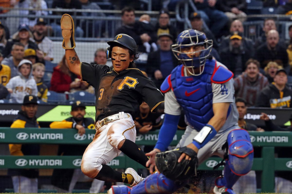 Ji Hwan Bae of the Pittsburgh Pirates scores from an RBI single in the fourth inning against the Los Angeles Dodgers at PNC Park on April 25, 2023 in Pittsburgh, Pennsylvania.