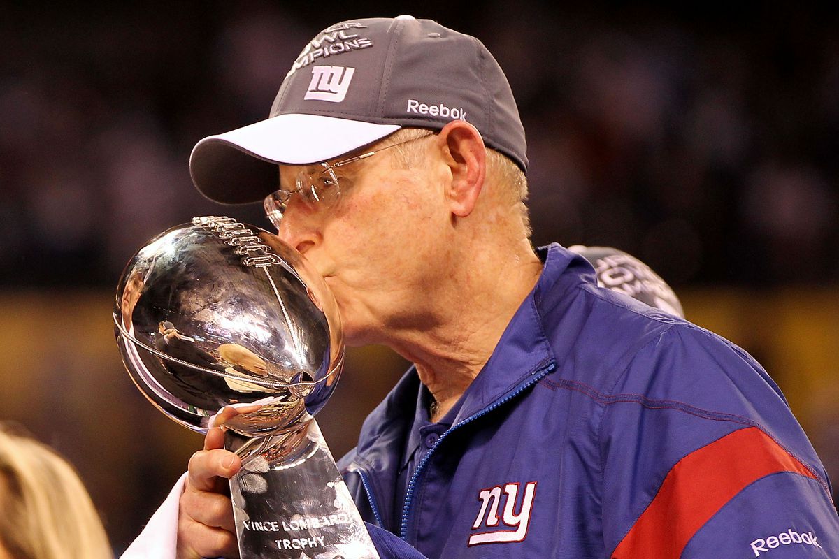 Tom Coughlin kisses the Lombardi Trophy after the 2012 Super Bowl.