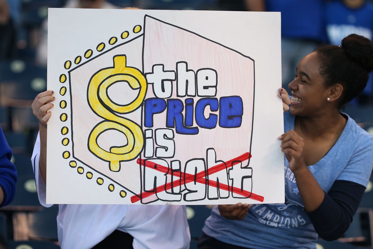 KANSAS CITY, MO - OCTOBER 23: Two young girls with their sign which mocks the signs in Toronto which claims 'the Price is Right' referring to starting pitcher David Price of the Blue Jays. Toronto Blue Jays Vs Kansas City Royals in Game 6 of the ALCS at Kauffman Field. Jays lose 4-3 and lose the series 4-2. Kansas City goes on to the World Series against the New York Mets. Toronto Star/Rick Madonik.