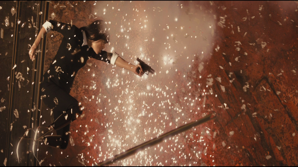 Sofia Boutella fires a gun in Kingsman: The Secret Service.