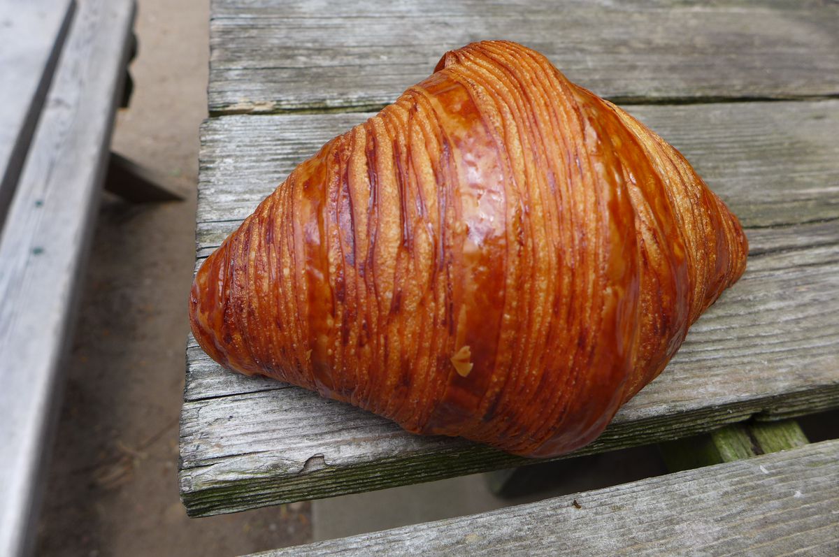 A symmetrical croissant of the linear variety, golden brown.