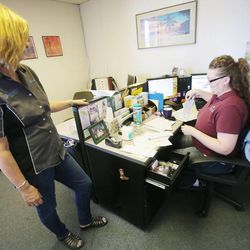 Debbie Jacketta talks with dispatcher Alanna Mumford of Jacketta Sweeping Service Friday, June 7, 2013, in West Valley City. Jacketta was named a Utah Business Owner of the Year.