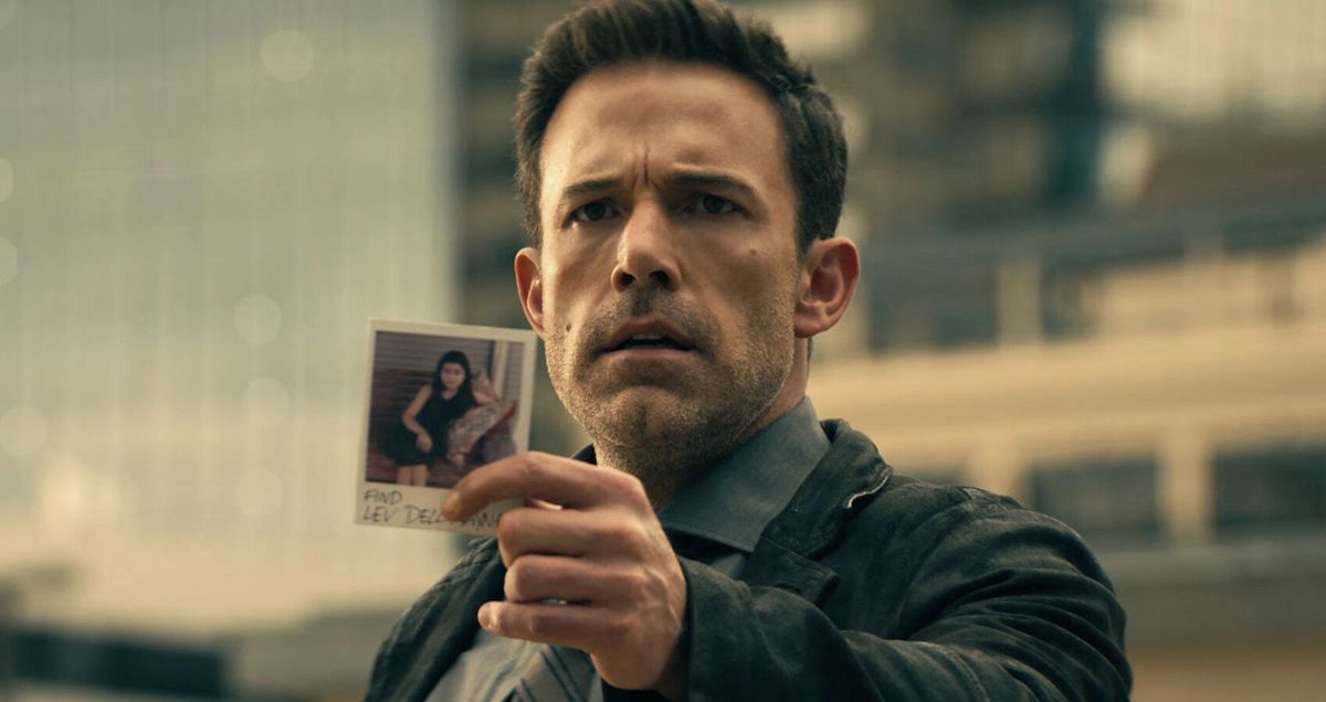 Ben Affleck holding a photograph in Hypnotic
