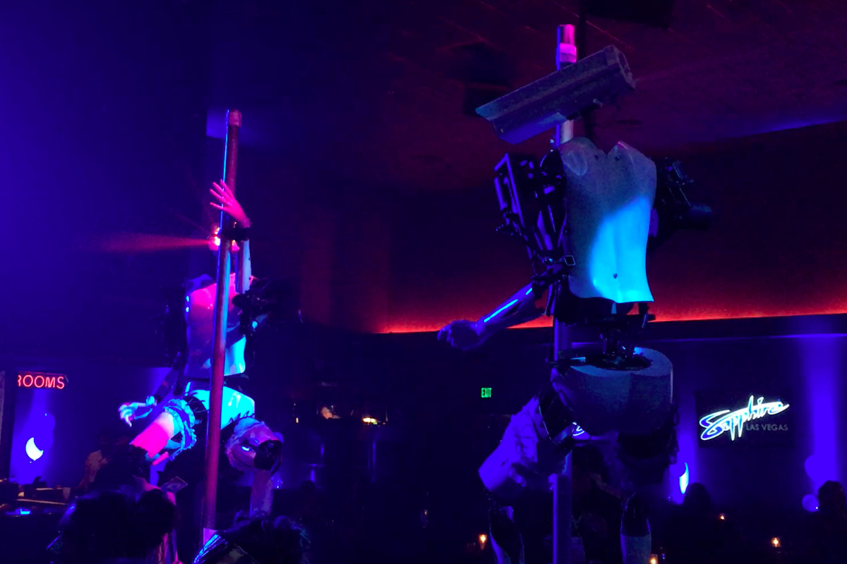 Photo of two robots dance at a nightclub at CES 2018 in Las Vegas, Nevada.