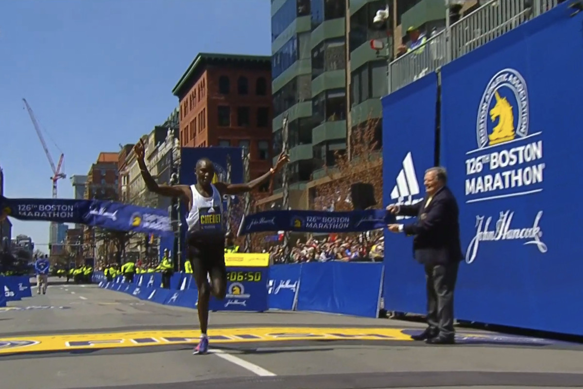 Kenyan male Evans Chebet crosses the finish line to win the 2022 Boston Marathon.