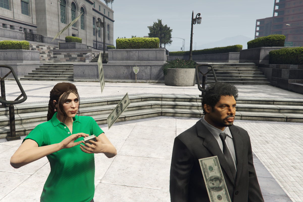 GTA Online - a woman “makes it rain” while standing next to a bemused NPC