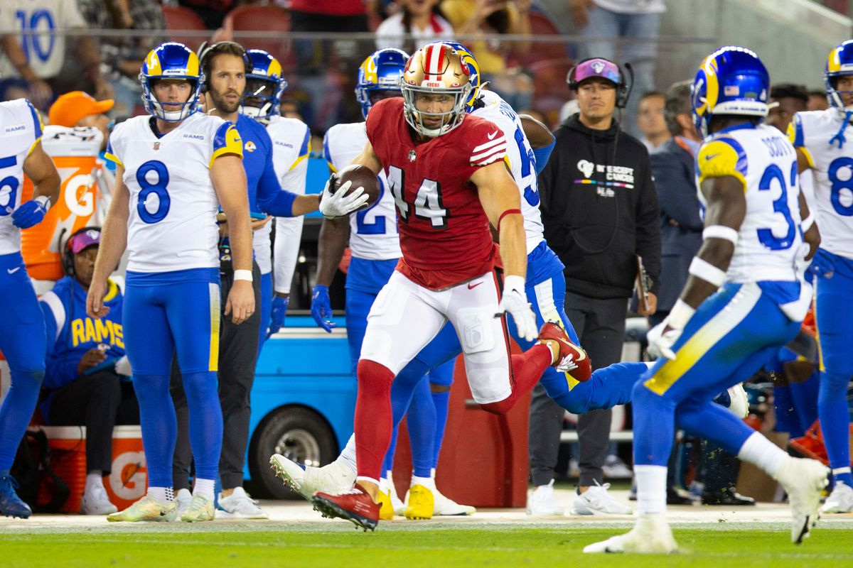 Kyle Juszczyk #44 of the San Francisco 49ers runs after making a catch during the game against the Los Angeles Rams at Levi’s Stadium on October 3, 2022 in Santa Clara, California.