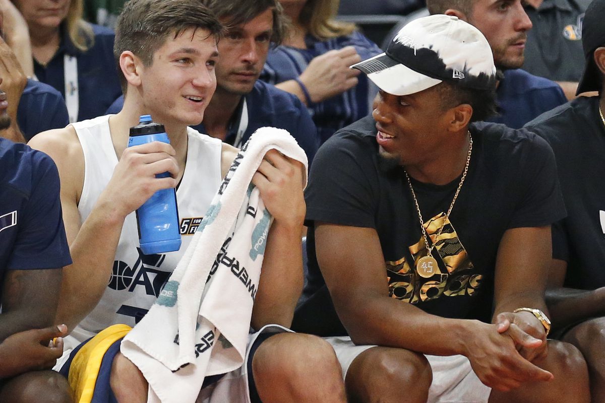 Utah Jazz's Donovan Mitchell, right, speaks with Grayson Allen as he sits on the bench during the first half of the team's NBA summer league basketball game against the Atlanta Hawks on Thursday, July 5, 2018, in Salt Lake City. (AP Photo/Rick Bowmer)