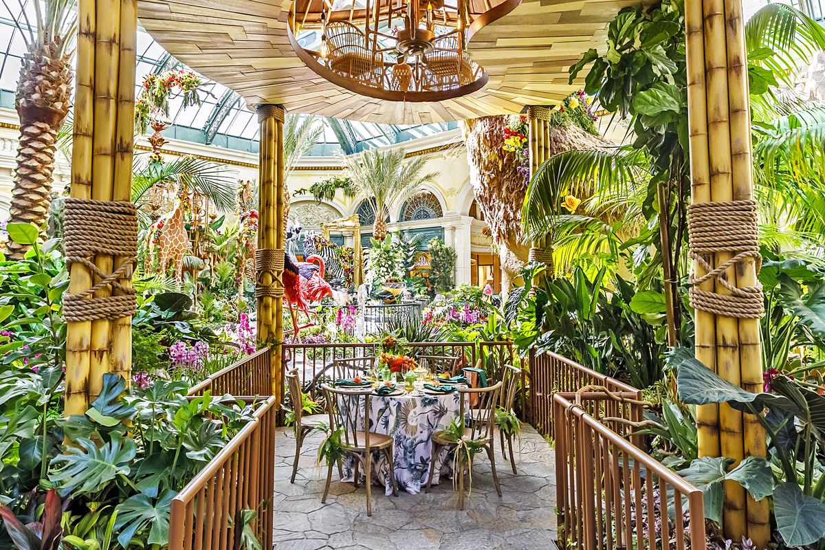 A ding table located inside the Bellagio Conservatory and Botanical Gardens