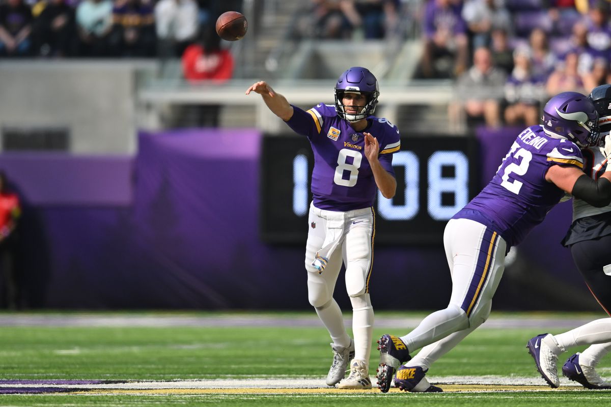 Minnesota Vikings quarterback Kirk Cousins (8) throws a pass against the Chicago Bears during the second quarter at U.S. Bank Stadium.
