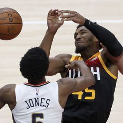 New Orleans Pelicans forward Herbert Jones (5) and Utah Jazz guard Donovan Mitchell (45) reach for the rebound during an NBA game at the Vivint Arena in Salt Lake City on Friday, Nov. 26, 2021. The Jazz lost 97-98.