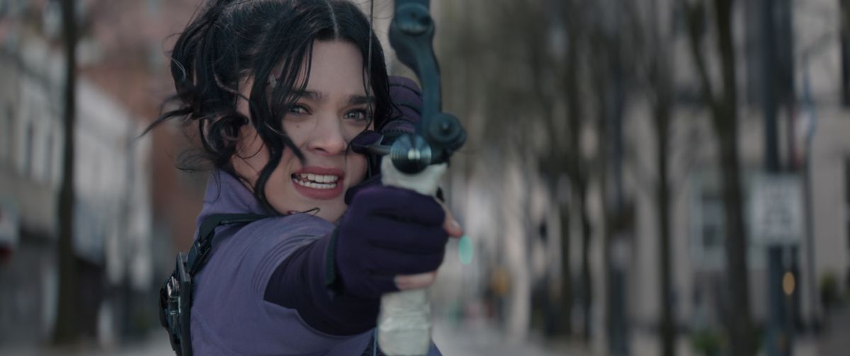 Kate Bishop fires an arrow while in a moving car in Hawkeye