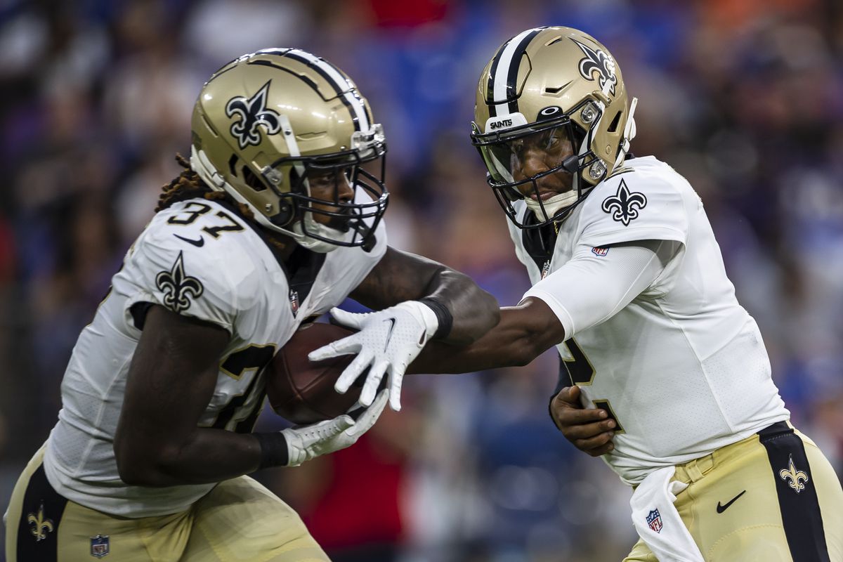Jameis Winston #2 of the New Orleans Saints hands the ball off to Tony Jones Jr. #37 during the first half of a preseason game against the Baltimore Ravens at M&amp;T Bank Stadium on August 14, 2021 in Baltimore, Maryland.