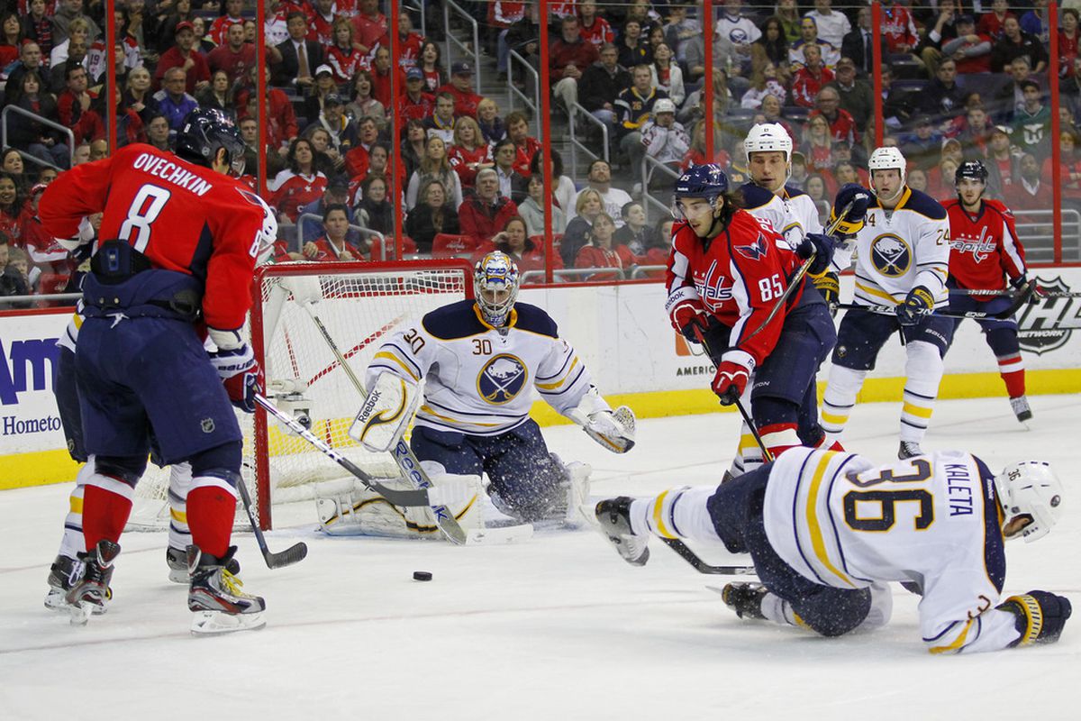 March 27, 2012; Washington, DC, USA; Buffalo Sabres goalie Ryan Miller (30) makes a save on Washington Capitals left wing Alex Ovechkin (8) in the second period at Verizon Center. Mandatory Credit: Geoff Burke-US PRESSWIRE