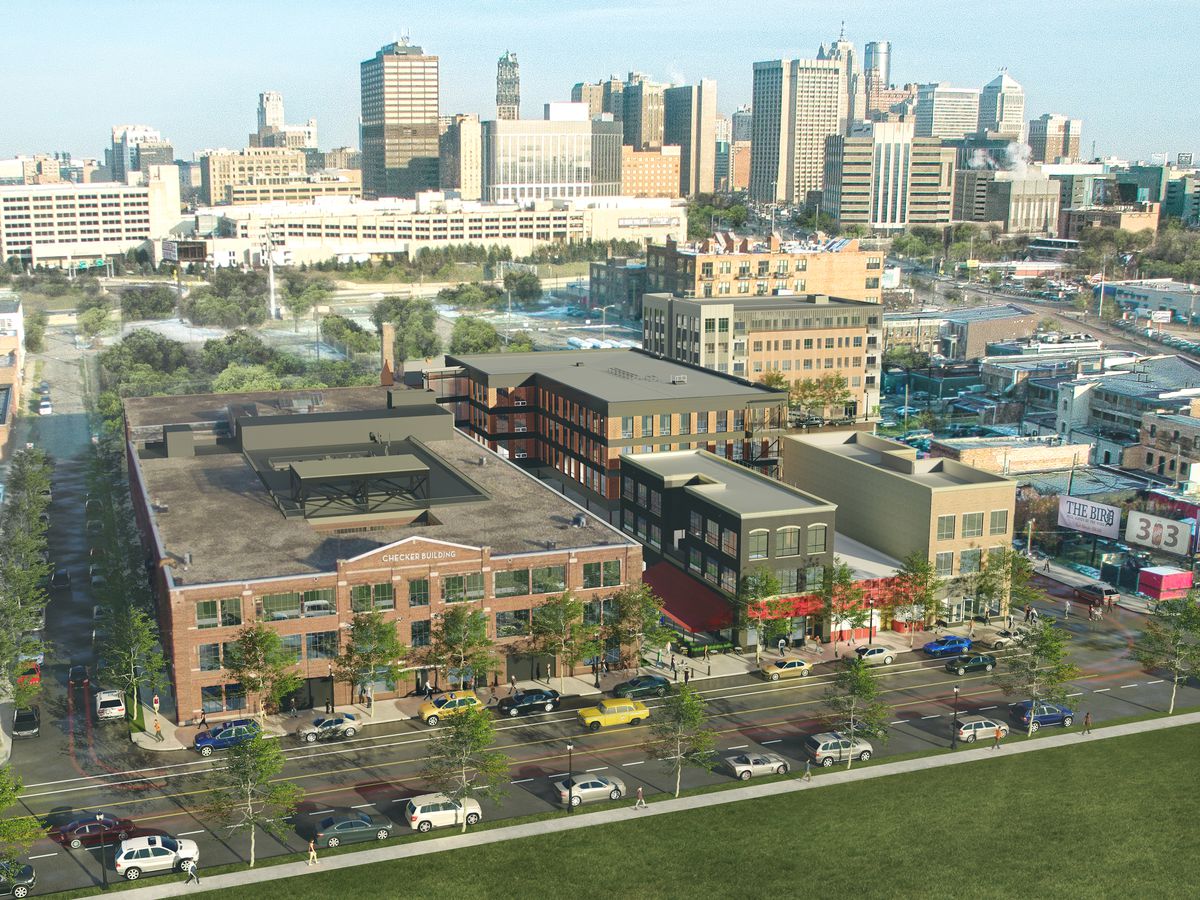 An overhead rendering of a redeveloped brick building with the downtown Detroit skyline in the background