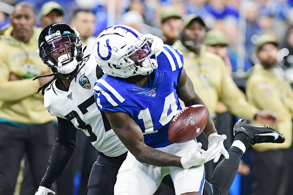 Indianapolis Colts receiver Zach pascal tries to make a reception as he is defended by Jacksonville Jaguars corner back Tre Herndon in the second half at Lucas Oil Stadium.