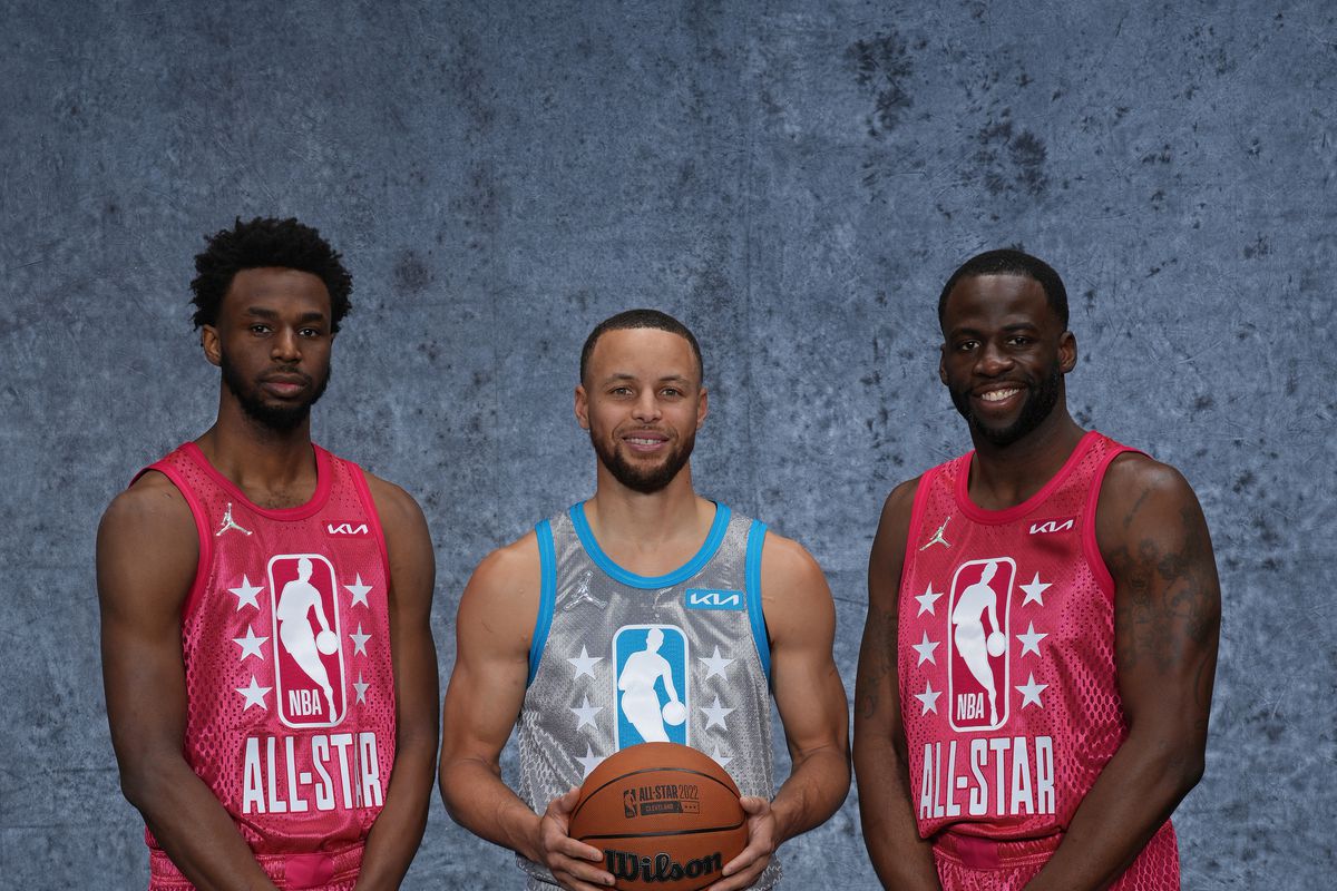 Steph Curry, Draymond Green, and Andrew Wiggins pose at the 2022 All-Star Game