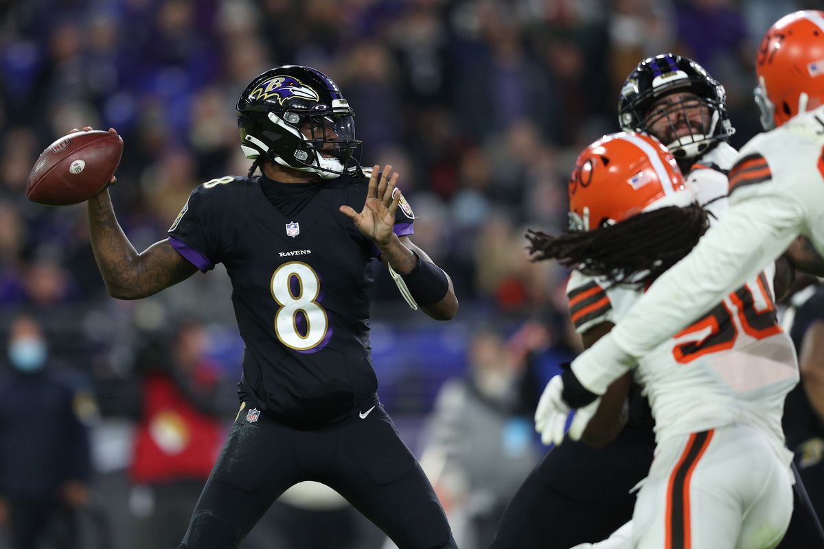 Quarterback Lamar Jackson #8 of the Baltimore Ravens runs with the ball against the Cleveland Browns at M&amp;T Bank Stadium on November 28, 2021 in Baltimore, Maryland.