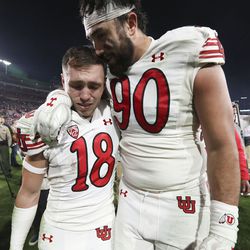 Utah Utes wide receiver Britain Covey and Devin Kaufusi walk off the field after Utah’s 48-45 loss to Ohio in the 108th Rose Bowl game in Pasadena, Calif., on Saturday, Jan. 1, 2022.