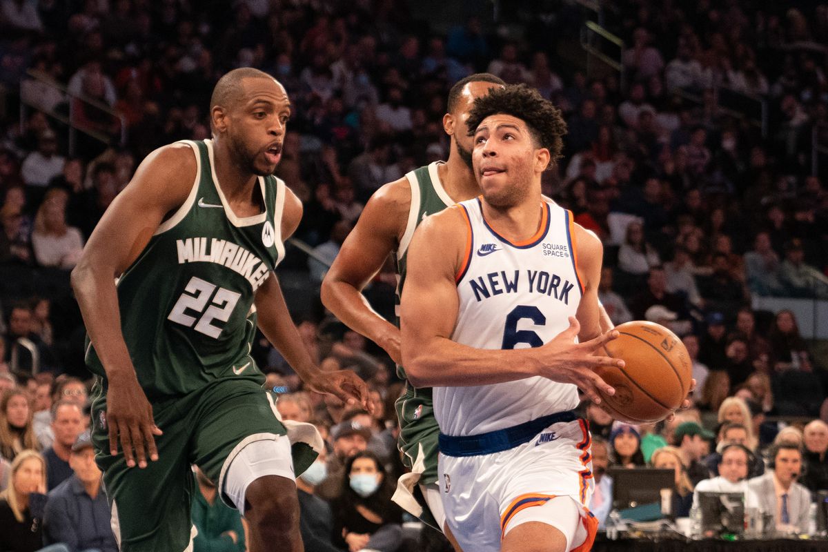 New York Knicks shooting guard Quentin Grimes (6) drives the ball toward the basket with Milwaukee Bucks small forward Khris Middleton (22) defending during the first half at Madison Square Garden.