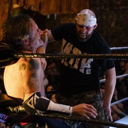 Nick Gage hits David Arquette with a forearm during their deathmatch Friday night at Joey Janela’s LA Confidential in Los Angeles.